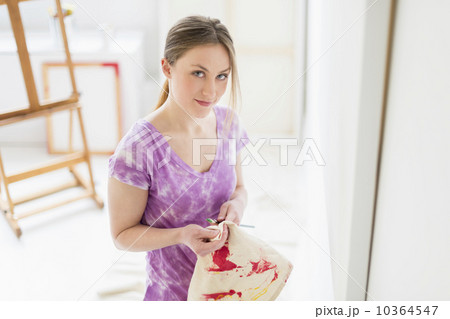 Portrait of female artist in studio 10364547