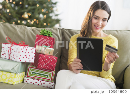 Woman buying christmas gift via internet 10364600