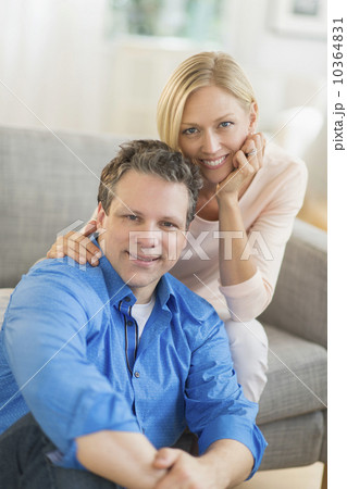 Portrait of couple sitting on sofa Portrait of couple sitting on sofa 10364831