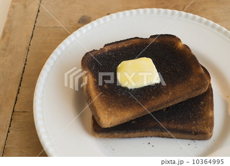 Burnt toasts on plate 10364995
