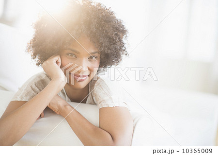 Portrait of woman relaxing on sofa 10365009