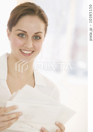 Smiling woman with papers 10365150