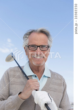 Senior man holding golf club 10365550