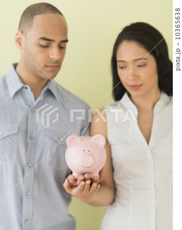 Young couple holding piggy bank 10365638