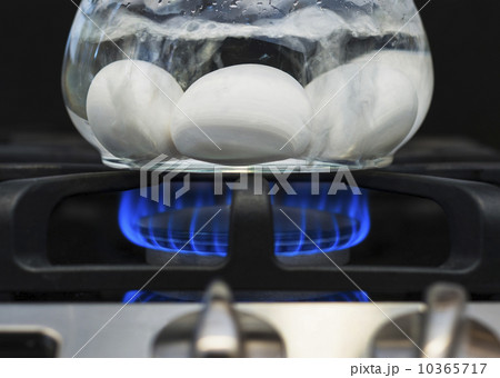 Close-up of eggs boiling on gas burner Close-up of eggs boiling on gas burner 10365717