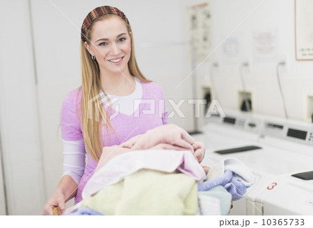 Woman in laundry room 10365733