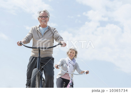 Senior couple riding bicycle 10365734