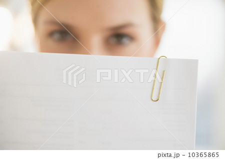 Close-up of young woman reading documents 10365865