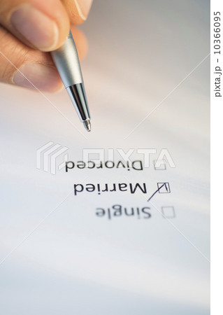 Close-up of hand filling out form 10366095