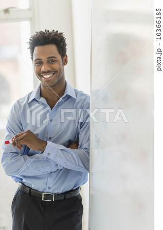 Businessman writing on whiteboard 10366185