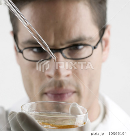 Lab technician with Petri dish Lab technician with Petri dish 10366194