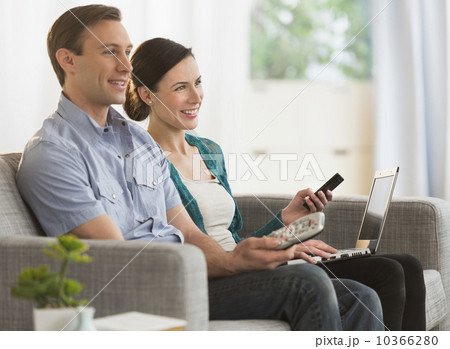 Couple watching tv together Couple watching tv together 10366280