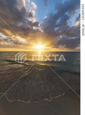 Sun setting over sea 10366304