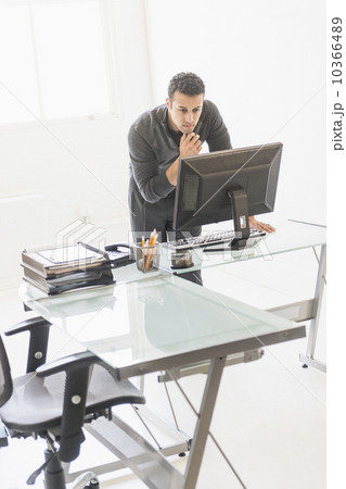 Businessman working at desk 10366489