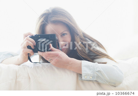 Portrait of woman photographing 10366674