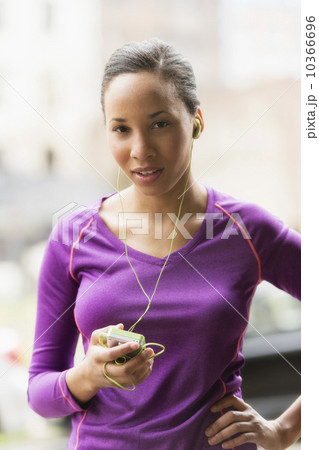 Portrait of female jogger with mp3 player 10366696
