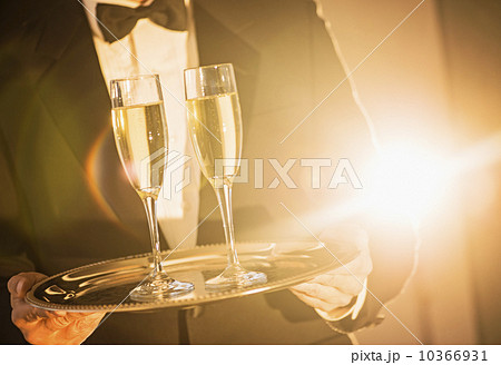 Waiter holding tray with champagne 10366931