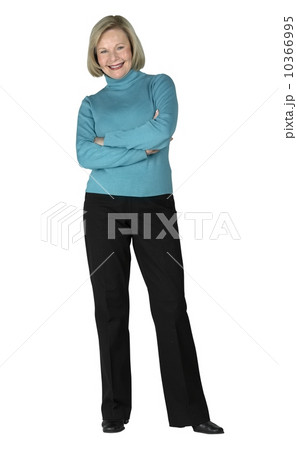 A woman standing with her arms folded 10366995