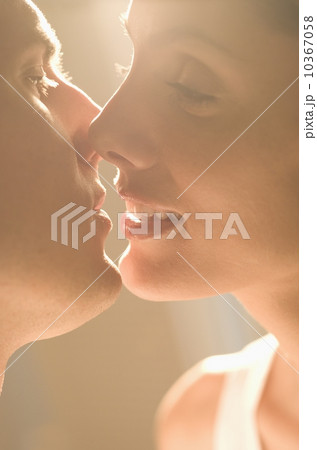 Closeup of couple kissing in sunlight 10367058