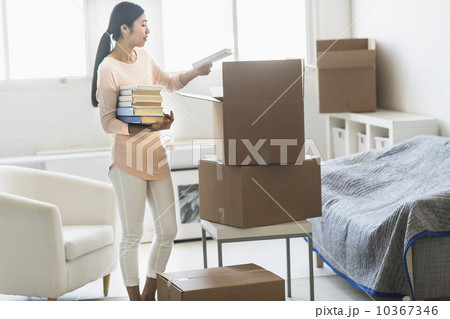 Woman moving home Woman moving home 10367346