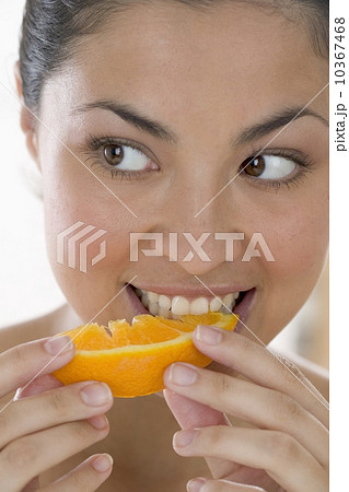 Woman eating orange 10367468