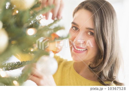 Woman decorating christmas tree 10367528