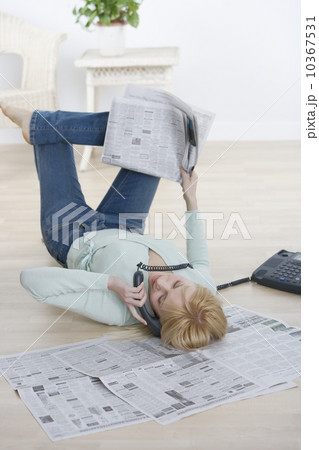 Woman on phone lying on back Woman on phone lying on back 10367531