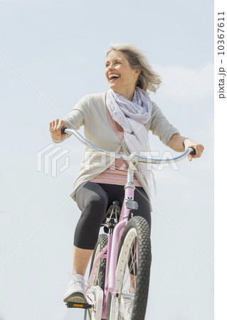 Senior woman riding bicycle 10367611