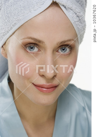 Smiling woman with towel on head 10367620