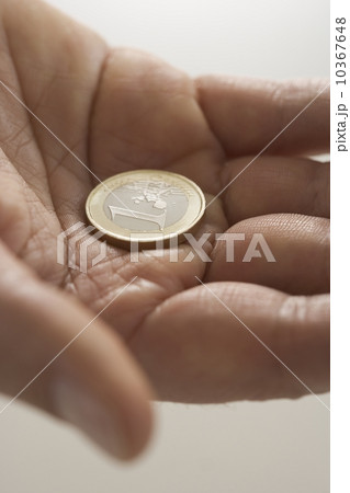 Closeup of Euro coin in palm 10367648