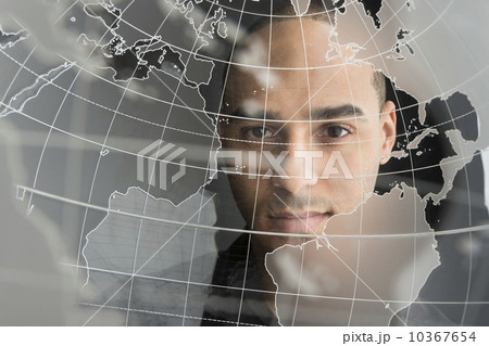 Digital portrait of young man on world map 10367654