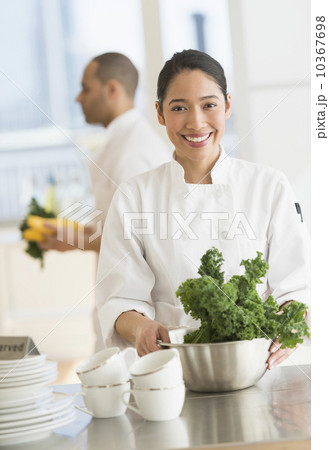 Couple during preparations in kitchen of their own restaurant 10367698