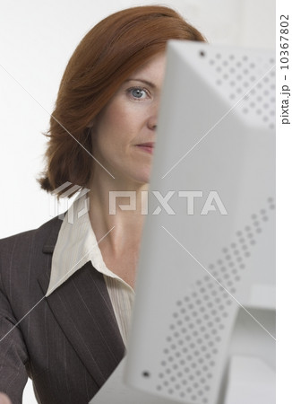 Businesswoman with face hidden by computer 10367802