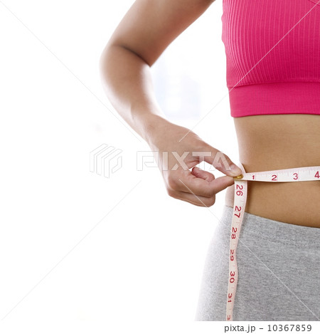 Woman measuring waistline Woman measuring waistline 10367859