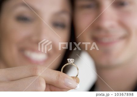 Closeup of ring and admiring couple Closeup of ring and admiring couple 10367898