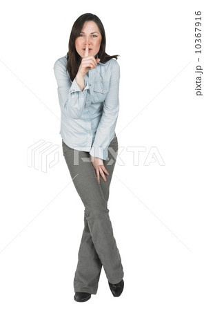 Woman gesturing to be quiet 10367916
