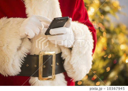 Santa claus holding cell phone 10367945