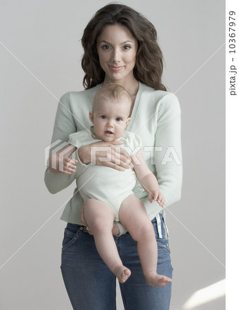 Standing woman holding baby 10367979