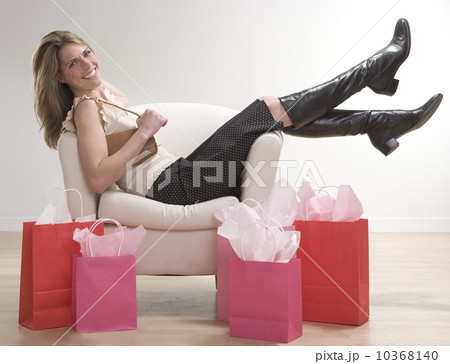 Woman relaxing after shopping Woman relaxing after shopping 10368140