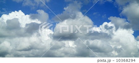 Puffy white clouds against a blue sky 10368294