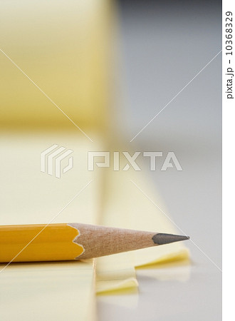 Sharpened pencil on pad of paper 10368329