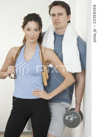 Couple with jump-rope towel and weight Couple with jump-rope towel and weight 10368368