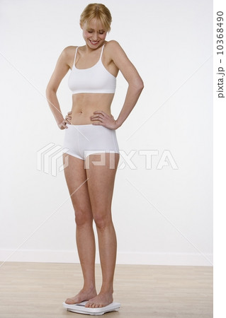 Happy woman on scale 10368490