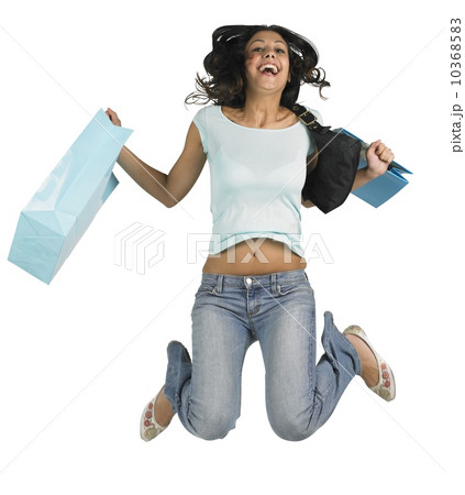 Young woman jumping with shopping bags 10368583