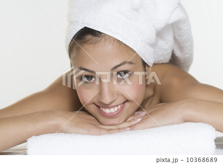 Smiling woman with towel on head 10368689