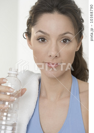Smiling woman with water bottle 10368790
