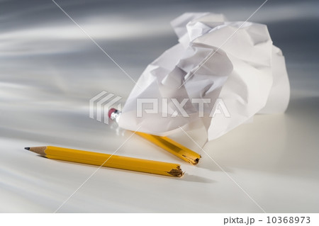 Closeup of broken pencil and crumpled paper 10368973