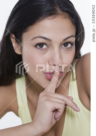 Portrait of woman with finger to lips 10369042