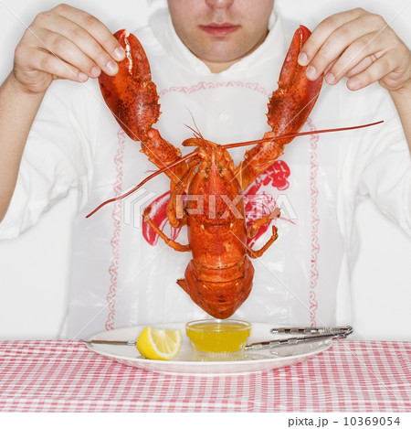 Man dining with an entire lobster 10369054