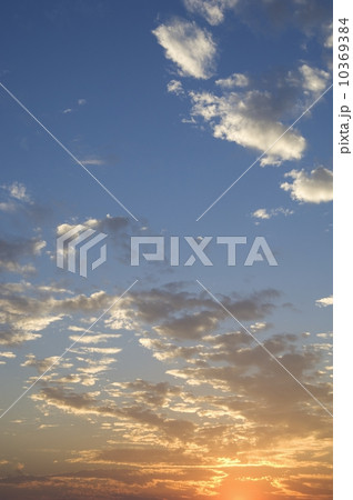 Sunset with puffy clouds 10369384